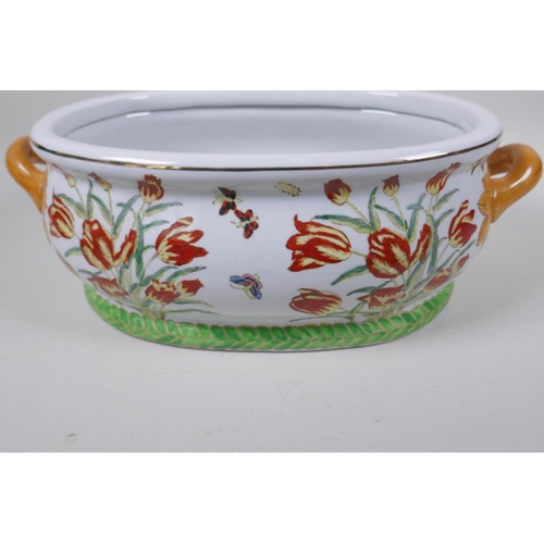 21 - A Chinese porcelain foot bath painted with flowers, butterflies and fish in bright enamels, 43cm wid... 