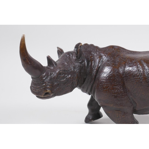 26 - A filled bronze medal of rhinoceros, 23cm long