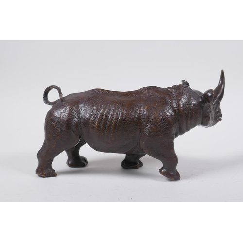 26 - A filled bronze medal of rhinoceros, 23cm long