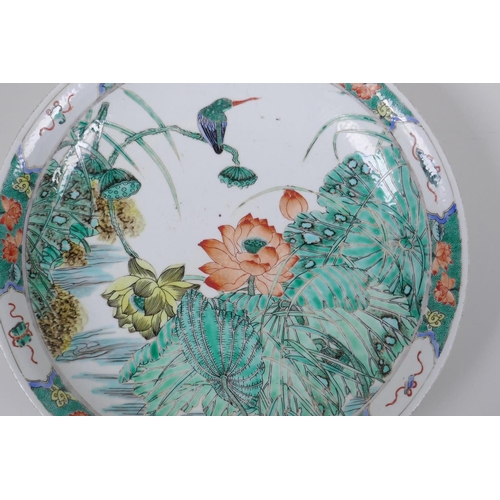 28 - A famille vert porcelain charger decorated with a Kingfisher amongst lotus flowers, Chinese KangXi 6... 