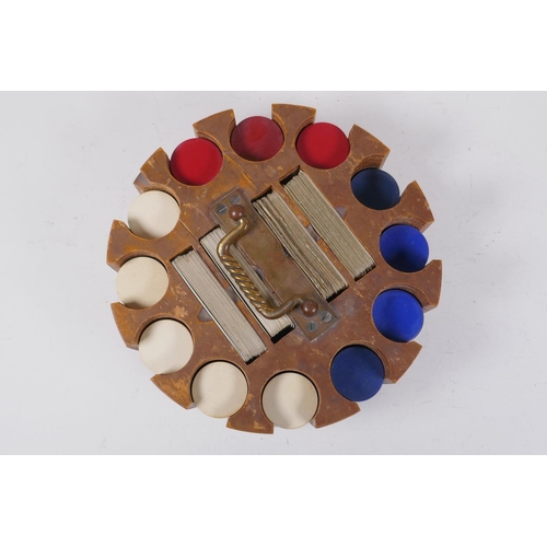 29 - A vintage wooden gaming chip and card caddy, 24cm diameter