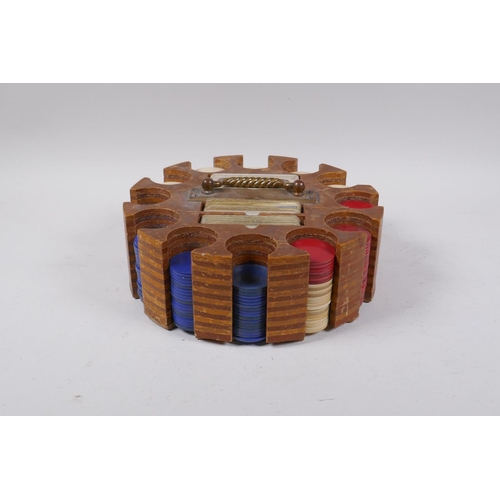 29 - A vintage wooden gaming chip and card caddy, 24cm diameter