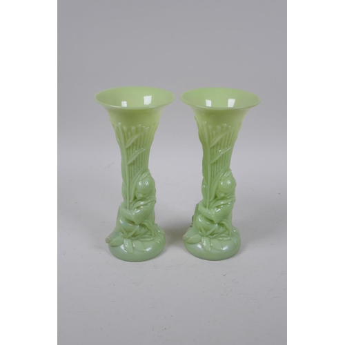 41 - A pair of early C20th Art Nouveau milk glass spill vases in the form of a figure carrying bamboo, 20... 