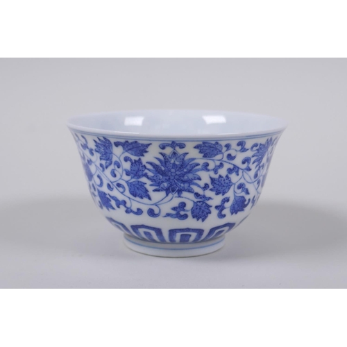 43 - A blue and white porcelain tea bowl with scrolling lotus flower decoration, Chinese Qianlong seal ma... 