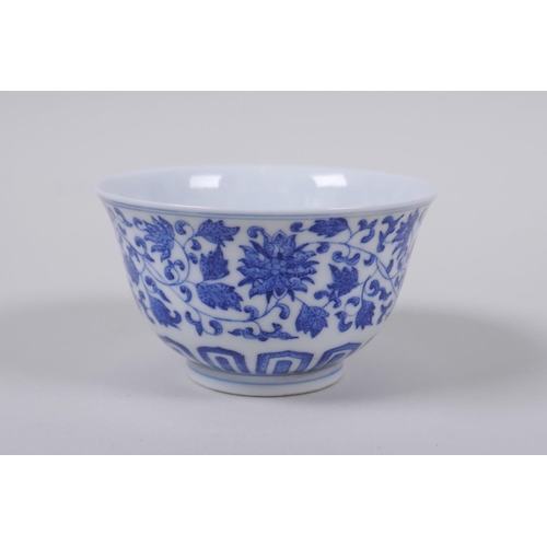 43 - A blue and white porcelain tea bowl with scrolling lotus flower decoration, Chinese Qianlong seal ma... 