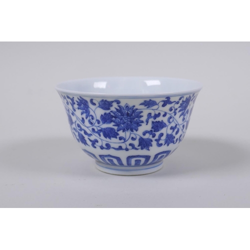 43 - A blue and white porcelain tea bowl with scrolling lotus flower decoration, Chinese Qianlong seal ma... 