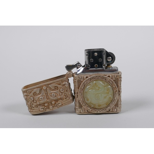 45 - A Chinese white metal cased Zorro lighter with a jade setting depicting a dragon, 6cm high