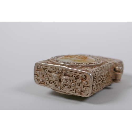 45 - A Chinese white metal cased Zorro lighter with a jade setting depicting a dragon, 6cm high