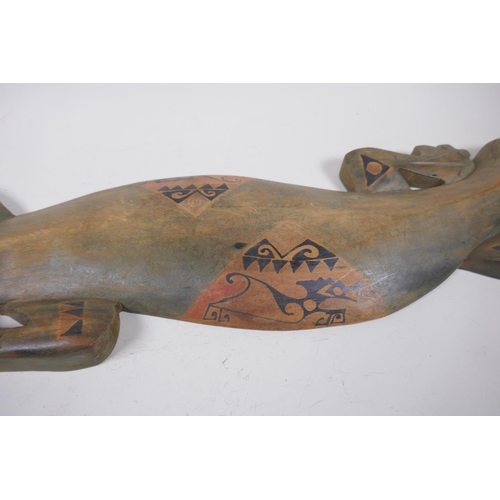 47 - An Aboriginal stained and painted carved wood lizard, 100cm long