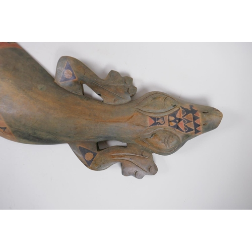 47 - An Aboriginal stained and painted carved wood lizard, 100cm long