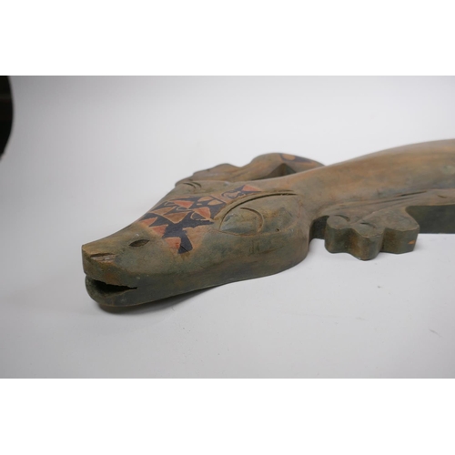 47 - An Aboriginal stained and painted carved wood lizard, 100cm long