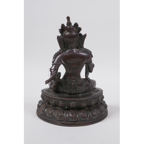 61 - A Sino Tibetan bronze of Buddha seated on a lotus throne, 19cm high