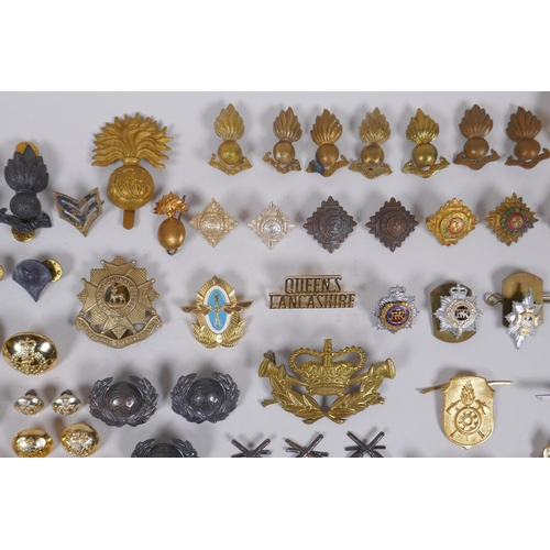 15 - A collection of military buttons, badges, pins etc