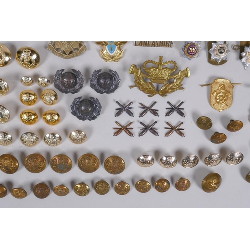 15 - A collection of military buttons, badges, pins etc