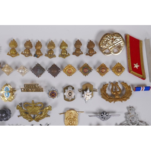 15 - A collection of military buttons, badges, pins etc