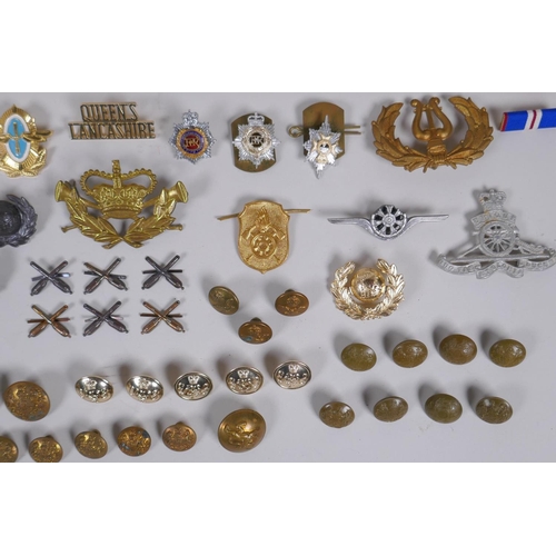 15 - A collection of military buttons, badges, pins etc