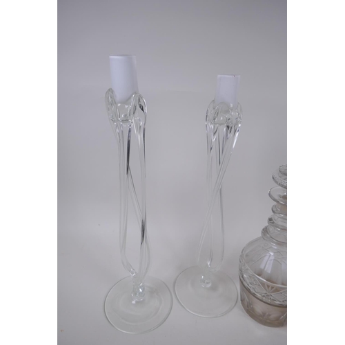 18 - A pair of Georgian three ring neck decanters with star cut decoration, 27cm high, and a near pair of... 