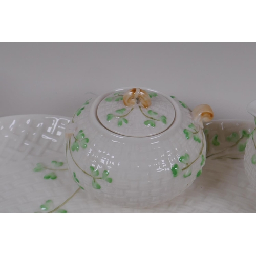 22 - A Belleek style Shamrock pattern china cabaret set with green harp and crown back stamp, sucrier AF,... 