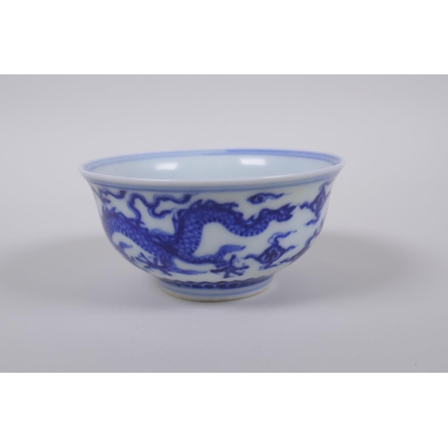 23 - A blue and white porcelain tea bowl with dragon decoration, Chinese Xuande 6 character mark to base,... 