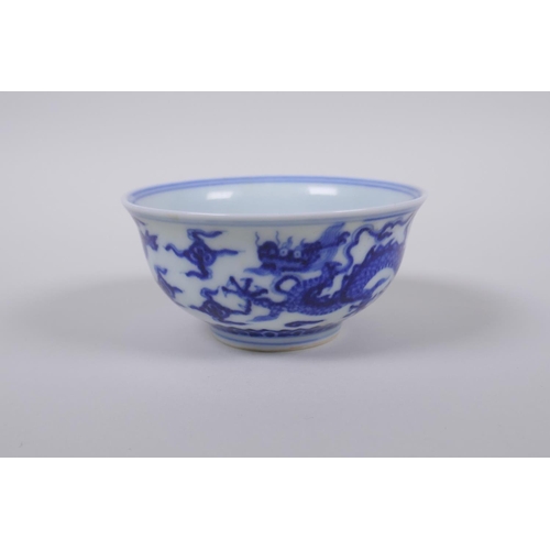 23 - A blue and white porcelain tea bowl with dragon decoration, Chinese Xuande 6 character mark to base,... 