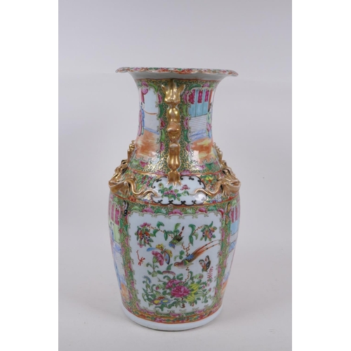 31 - A C19th Canton enamelled porcelain vase, with raised gilt fo-dog handles and dragon mounts, and deco... 