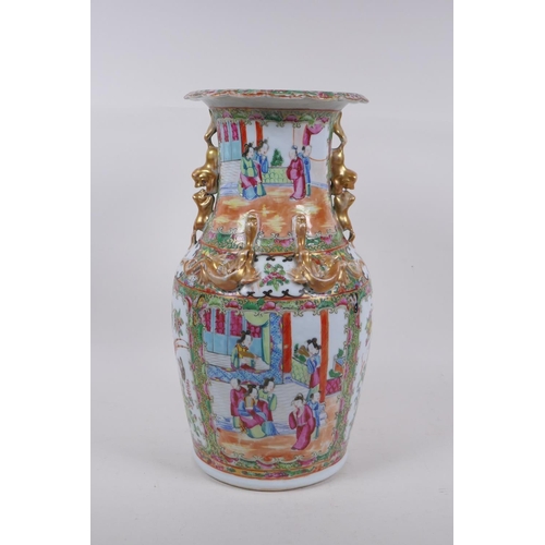 31 - A C19th Canton enamelled porcelain vase, with raised gilt fo-dog handles and dragon mounts, and deco... 