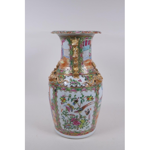 31 - A C19th Canton enamelled porcelain vase, with raised gilt fo-dog handles and dragon mounts, and deco... 