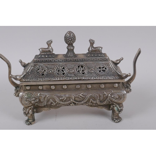 34 - A Chinese sarcophagus shaped cast white metal censer and cover, with raised dragon decoration, 20cm ... 