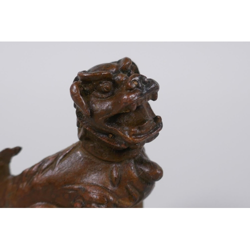 35 - A Japanese bronze okimono temple lion, 6cm high