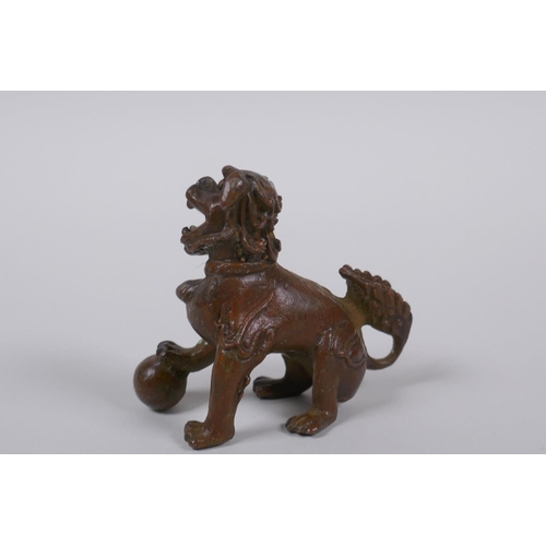 35 - A Japanese bronze okimono temple lion, 6cm high