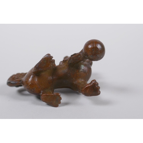 35 - A Japanese bronze okimono temple lion, 6cm high