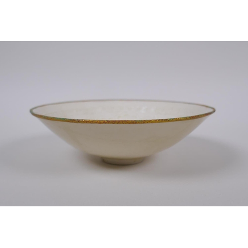 48 - A Chinese Dingware porcelain dish with raised waterfowl decoration and a gilt metal rim, marks to ba... 