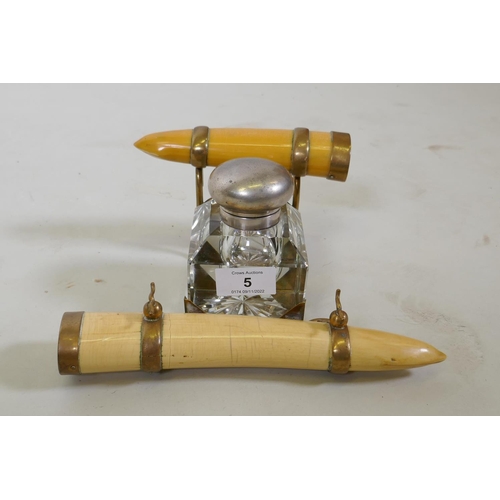 5 - A Victorian inkwell with brass mounted faux ivory tusks, 24 x 12cm