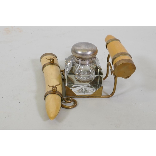 5 - A Victorian inkwell with brass mounted faux ivory tusks, 24 x 12cm