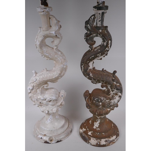 6 - A pair of cast iron lamp bases in the form of classical dolphins, 70cm high