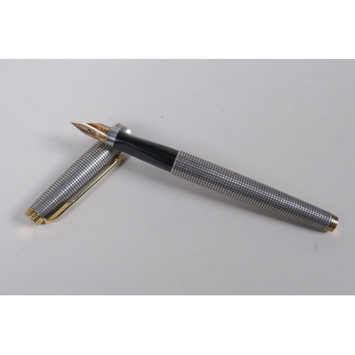 9 - An early C20th Parker Jackknife Lucky Curve gold filled fountain pen and matching propelling pencil,... 