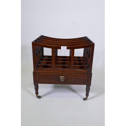 1143 - A Georgian mahogany canterbury with single drawer, ring turned supports and brass castors, 45 x 35cm... 