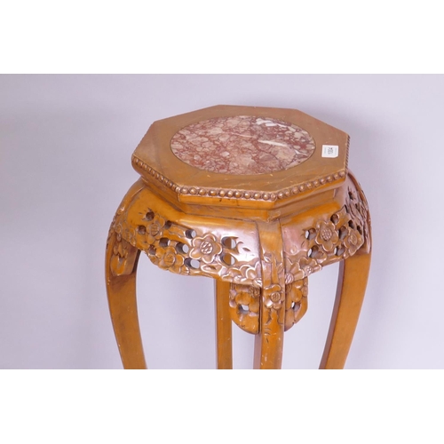 1140 - A Chinese vase stand with pierced frieze and inset marble top, 35cm diameter x 90cm