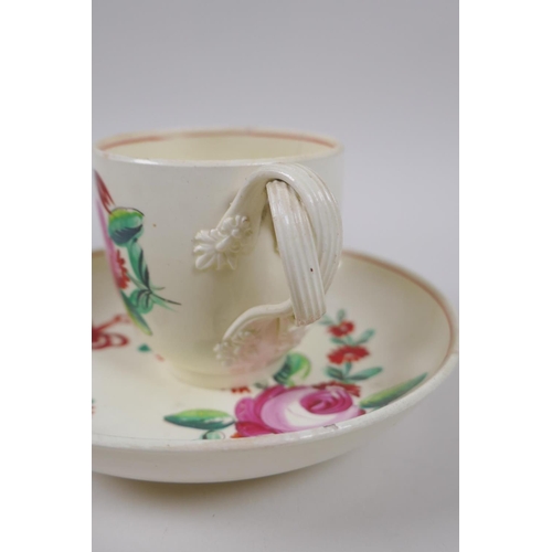 10 - A late C18th Staffordshire creamware teapot, cup and saucer, with flat reeded handles, flower moulde... 