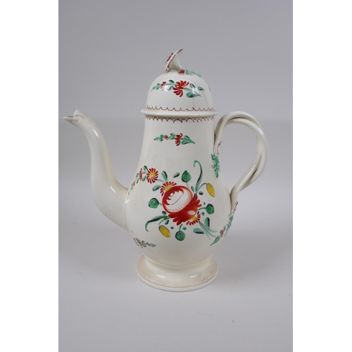 10 - A late C18th Staffordshire creamware teapot, cup and saucer, with flat reeded handles, flower moulde... 