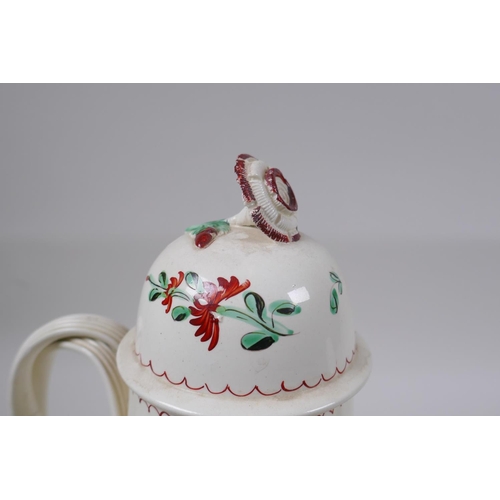 10 - A late C18th Staffordshire creamware teapot, cup and saucer, with flat reeded handles, flower moulde... 