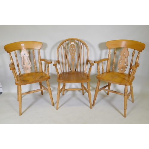 1138 - A pair of beech elbow chairs and a beech Windsor armchair