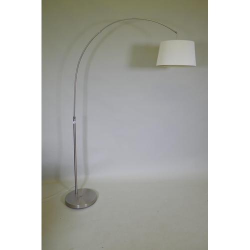 1145 - A contemporary brushed steel floor lamp, 180cm high