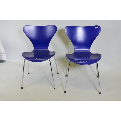 1146 - A pair of Danish Fritz Hansen chairs after Arne Jacobsen, blue painted wood seats and chrome support... 