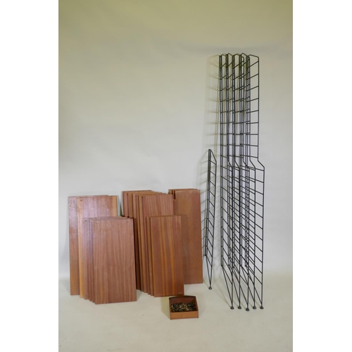 1148 - A mid century teak veneered modular shelving system comprising eighteen shelves, five tall and one s... 