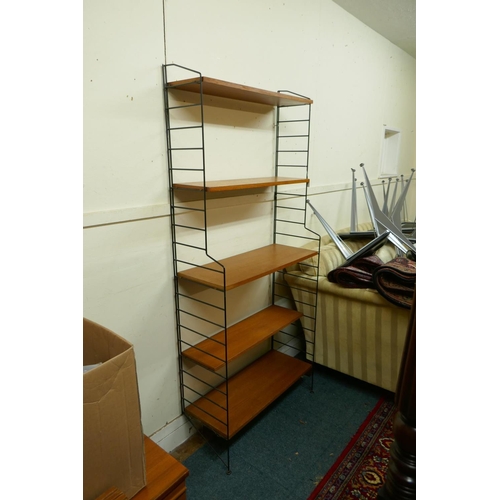 1148 - A mid century teak veneered modular shelving system comprising eighteen shelves, five tall and one s... 