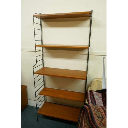 1148 - A mid century teak veneered modular shelving system comprising eighteen shelves, five tall and one s... 