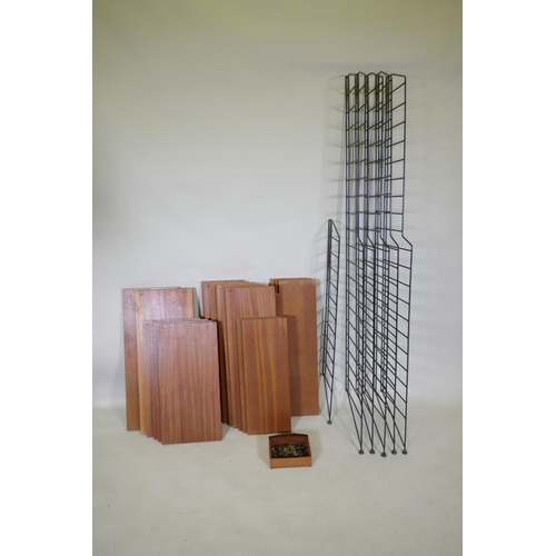 1148 - A mid century teak veneered modular shelving system comprising eighteen shelves, five tall and one s... 