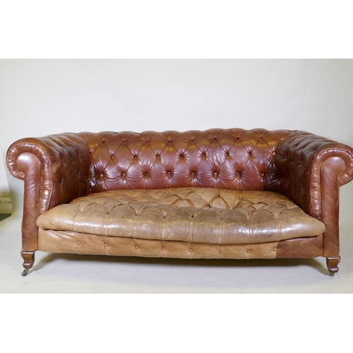 1150 - A leather chesterfield settee, raised on shaped beechwood supports, horse hair stuffed, springs need... 