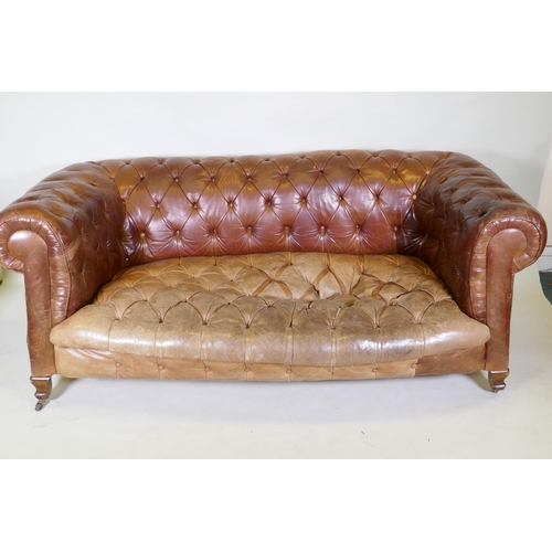 1150 - A leather chesterfield settee, raised on shaped beechwood supports, horse hair stuffed, springs need... 